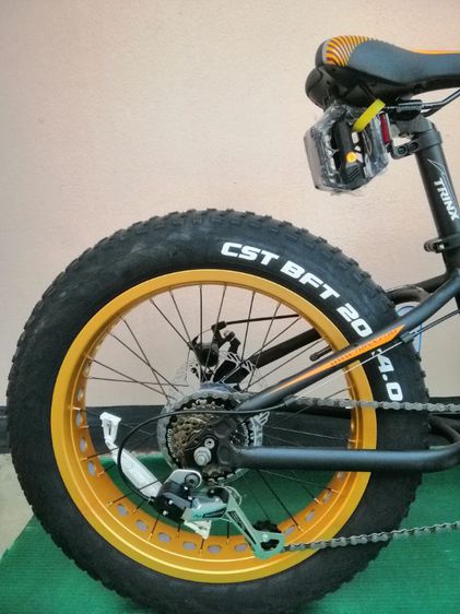 ใหม่ T100 จักรยานล้อโตเด็ก TRINX 20x4.0 นิ้ว เกียร์ 🔥SHIMANO 7 สปีด สีดำส้อล้อทอง รูปที่ 6