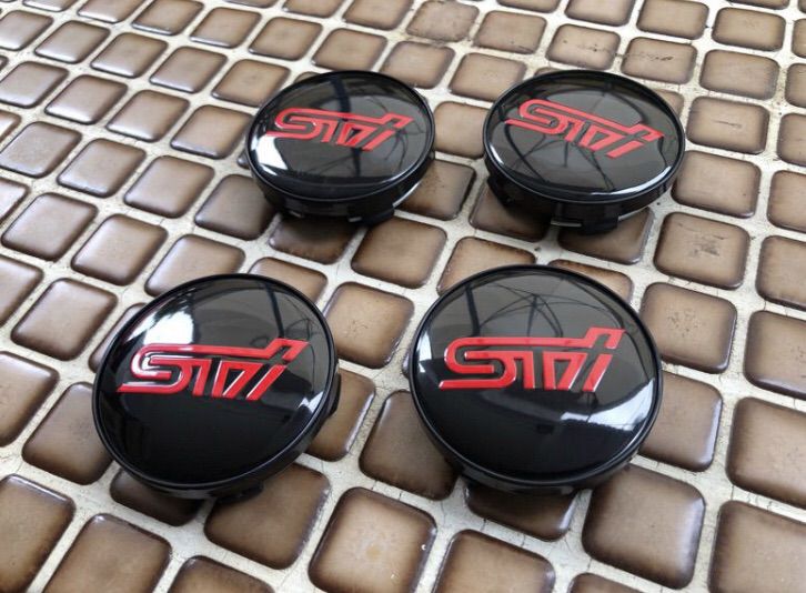 ฝาดุมล้อ SUBARU STi หน้ากว้าง 56 mm. และ 60 mm. มี 2 แบบ ขอบดำและ ขอบโครเมียม ใส่ได้กับหลายรุ่นเช่น IMPREZA FORESTER LEGACY XV รูปที่ 2