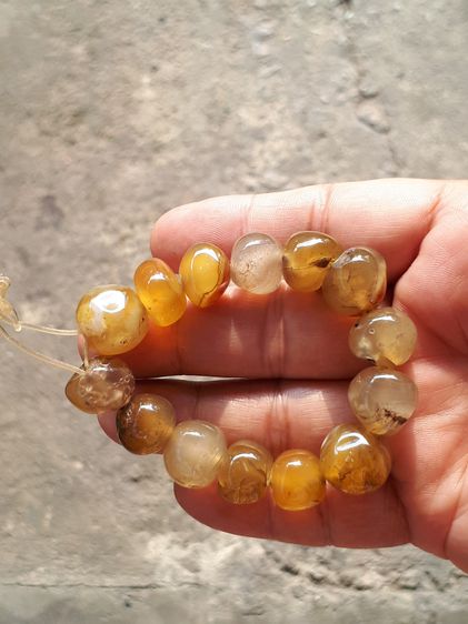 ข้อมือพลอยตาแมว หรือ พลอยไพฑูรย์ จำนวน 14 เม็ด ขนาดเม็ดใหญ่ กลมมน โปร่งใส สีสวย มีความทนทานของเนื้อพลอยนั้นยอดเยี่ยม นิยม คุณภาพดี เดิมๆ เป็ รูปที่ 10