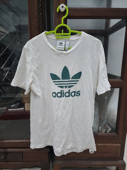 อื่นๆ เสื้อทีเชิ้ต แขนสั้น เสื้อยืด ทีเชิ้ต สีขาว ยี่ห้อ Adidas ของแท้ โลโก้ เขียวตัด สวย ใส่น้อย สภาพดี เนื้อผ้าบางเบา ใส่สบาย
