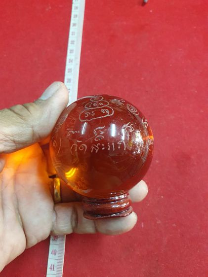 ลูกแก้วสารพัดนึกสีส้ม ขนาดเส้นผ่าศูนย์กลาง 5 เซนติเมตร ของหลวง ปู่ดู่วัดสะแกจังหวัดอยุธยา ปี 2532 มี 7 สี รูปที่ 2