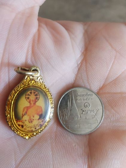 พระเหรียญ(เหรียญล็อกเก็ตพระหลวงพ่อใหญ่หลังพระนางกวักเก่า(ไม่ทราบอายุหรือพระเกจิที่สร้าง))พระบ้านพระเครื่องรางของมงคล รูปที่ 1