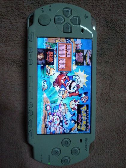 PSPรุ่น2เมม32GBแปลงแล้วมี25เกมส์ สีชาวสวยสภาพยังใหม่ รูปที่ 4