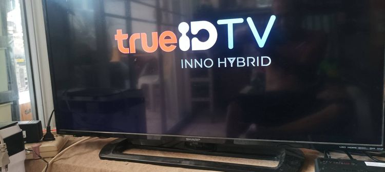 กล่อง TRUEID TV รุ่น hph07 ดูบอลดูแบตกีฬาทุกชนิดไม่เสียรายเดือน เปลี่ยนทีวีเก่าให้กลายเป็น Smart TVได้ทันที สวยๆขาย 990 บาท(มีรีโมทหม้อแปลง)