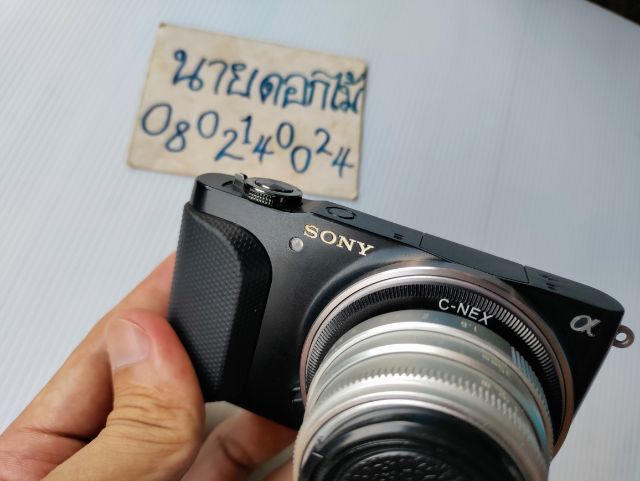 กล้องมิลเลอร์เลส Sony nex 3N  พร้อมเลนส์ มือหมุน 35f1.6
ตำหนิ แฟลชไม่ติด  ปุ่มกด ดูรูปไม่ติด แต่เข้าเมนู ดูรูปได้   