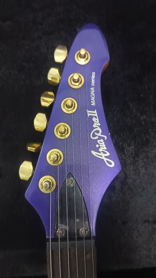กีต้าร์ไฟฟ้า ยี่ห้อ Aria Proll Magna Series HSH-FR 24Fret (ไม่รวมฮาร์ดเคส)
COLOR : Purple
NECK : Maple , Bolt-on
FINGER BOARD : ROSEWOOD 24F รูปที่ 2