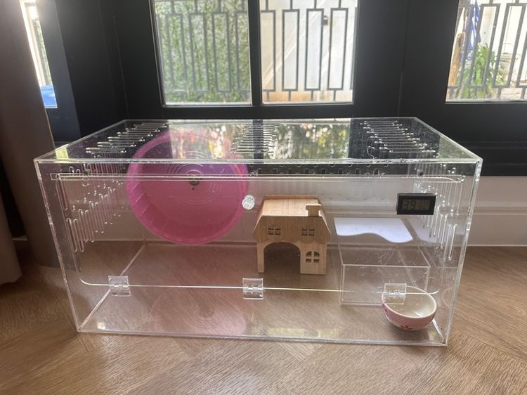 Hamster cage with feel and bedding and house