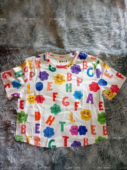เสื้อยืดป้าย wela happy 🙂
