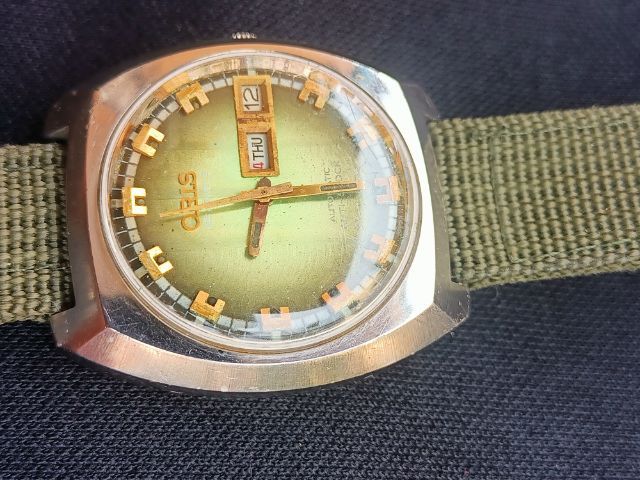 Vintage Oris Automatic 25 Jew.Anti-Shock 1973'sทรงถังเบียร์ หน้าเดิมเหลือบเขียว เครื่องใส เดินปรกติ ขนาด37x42mm. ก.ส.สวยพร้อมสายเขียวทหาร รูปที่ 7