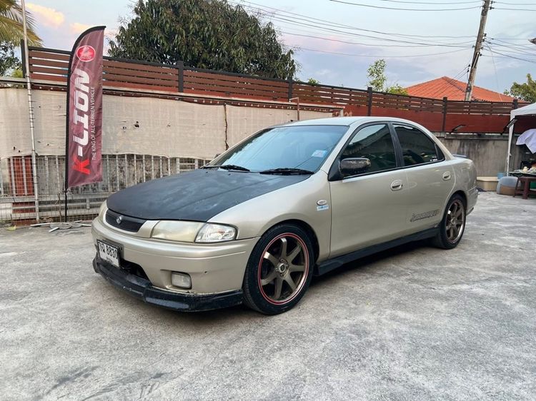 รถ Mazda 323 1.6 SGLX สี น้ำตาล