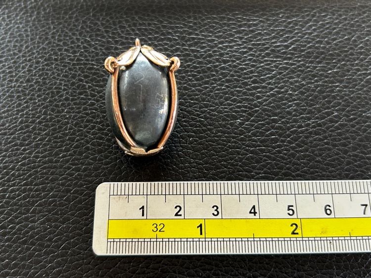 ตะกรุดลูกอมไม่ทราบที่เลี่ยมจับขอบ รูปที่ 4