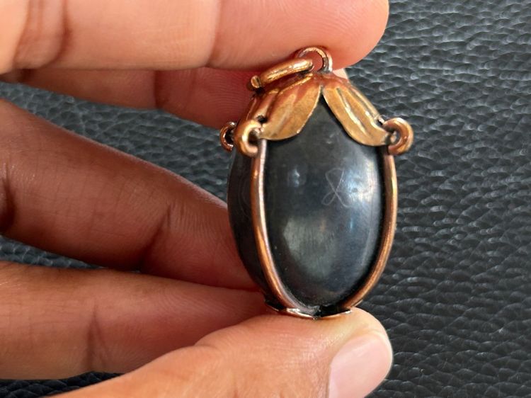 ตะกรุดลูกอมไม่ทราบที่เลี่ยมจับขอบ