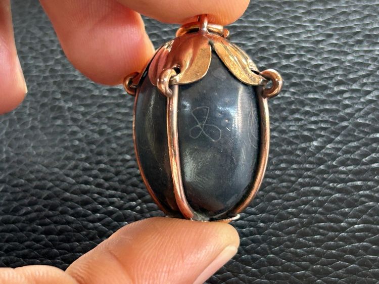 ตะกรุดลูกอมไม่ทราบที่เลี่ยมจับขอบ รูปที่ 11