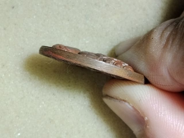 เหรียญพังพระกาฬเนื้อทองแดงเหมือนแช่น้ำมันอะไรมา รูปที่ 3