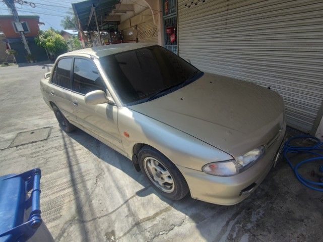 รถ Mitsubishi Lancer 1.6 GLXi LTD สี บรอนซ์ทอง