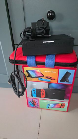 นินเทนโด้ Nintendo Switch OLED สี Neon Red Blue อุปกรณ์ครบชุดและแผ่นเกมอีก 2 เกม FC24 และ Assassin's Creed รูปที่ 3