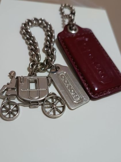 พวงกุญแจโค้ชมือ2สภาพใหม่กดดูนะคชามร์รถม้าพร้อมแท้กหนังะ