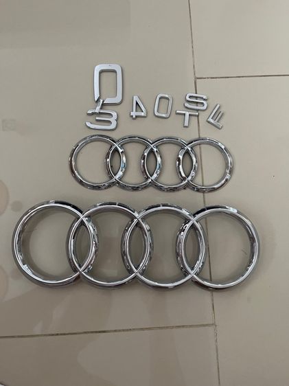 โลโก้สี่ห่วง ติดหน้ารถ และท้ายรถ