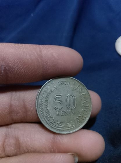 เป็นเหรียญกษาปณ์หมุนเวียนรุ่นแรกของสิงคโปร์ ผลิตขึ้นระหว่างปี ค.ศ. 1967 ถึง 1985 หายากเหลือเหรียญเดียวแล้ว รูปที่ 2