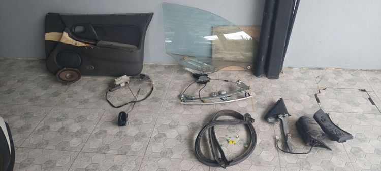 อะไหล่ แผงประตู คู่หน้า มาสด้า แลนติส แอสติน่า ตาหยี