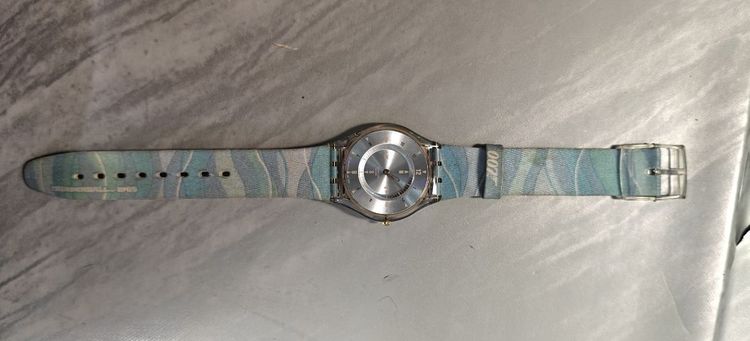 Swatch Skin SFK154 "Thunderball" Swatch รุ่น SFK154 จากคอลเลกชัน James Bond 007 "Thunderball" (1965) เปิดตัวครั้งแรกในปี 2002 ฉลองครบรอบ 40 