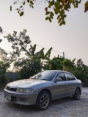 ขายรถยนต์ Mitsubishi lancer เครื่อง 1,600 cc. เกียร์ออโต้ สีเทาปี 2000 เบาะกำมะหยี่ เครื่อง ช่วงล่าง พร้อมใช้ แอร์เย็น เล่มทะเบียนพร้อมโอน