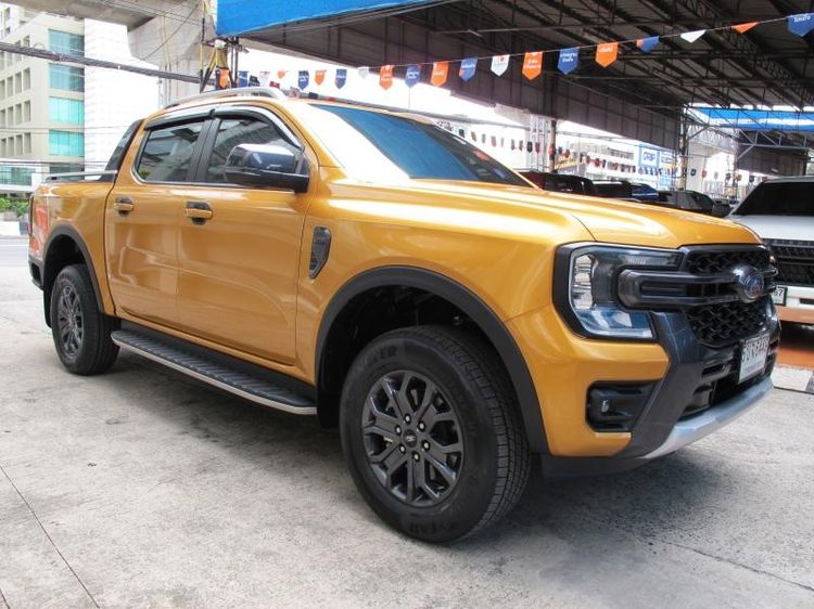 Ford Ranger 2024 2.0 Hi-Rider Wildtrak Pickup ดีเซล ไม่ติดแก๊ส เกียร์ธรรมดา ส้ม รูปที่ 2