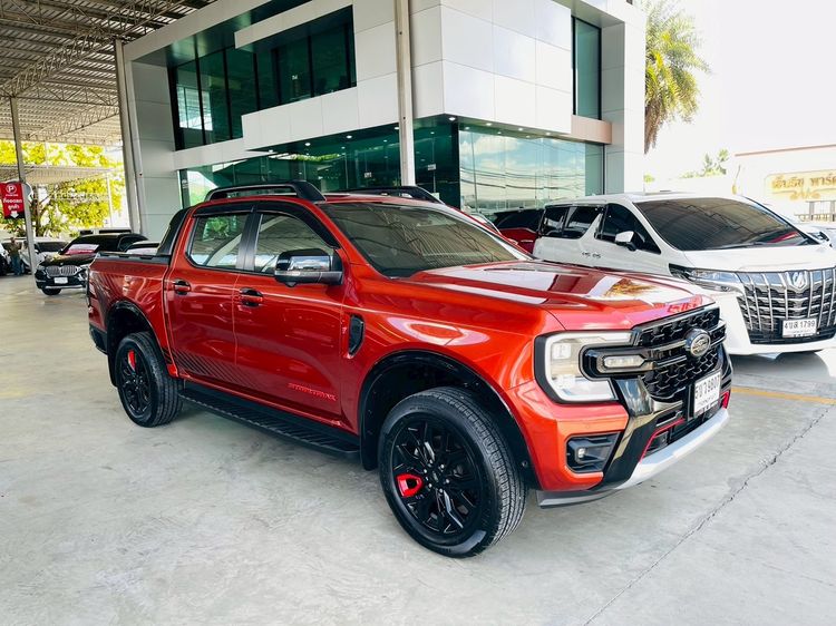 Ford Ranger 2024 2.0 Bi-Turbo 4WD Stormtrak Pickup ดีเซล ไม่ติดแก๊ส เกียร์อัตโนมัติ ส้ม รูปที่ 2