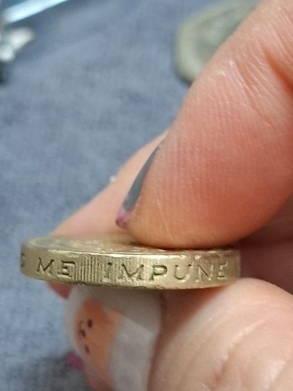 เหรียญ 1 ปอนด์ (One Pound Coin) จากสหราชอาณาจักร ผลิตขึ้นในปี 1994 รูปที่ 5