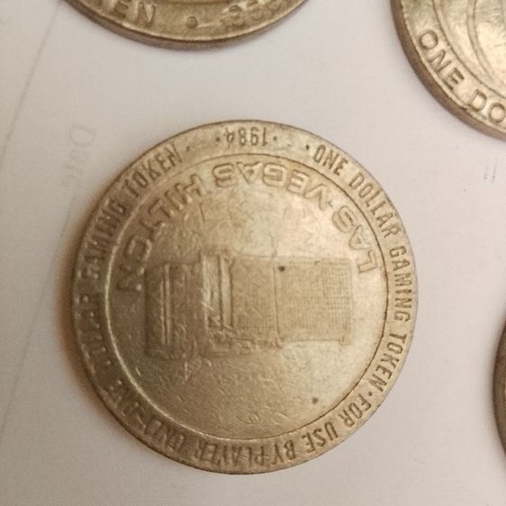 เหรียญโทเค็นสำหรับเล่นเกม (Gaming Token) มูลค่า 1 ดอลลาร์ จากคาสิโน MGM Grand ในลาสเวกัส ผลิตขึ้นในปี 1993 รูปที่ 4