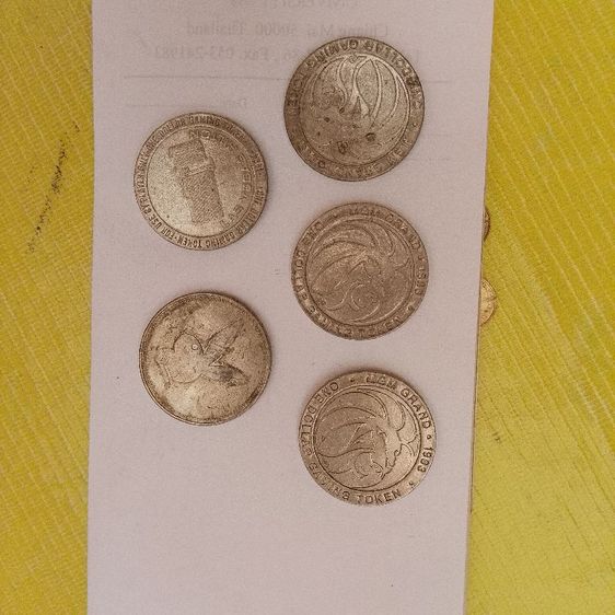 เหรียญโทเค็นสำหรับเล่นเกม (Gaming Token) มูลค่า 1 ดอลลาร์ จากคาสิโน MGM Grand ในลาสเวกัส ผลิตขึ้นในปี 1993