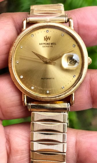 นาฬิกาข้อมือ Raymond Weil Geneve Automatic ตัวเรือน 18K .Ge.หน้าปัดทอง.หลักชั่วโมงเพชรแท้ เครื่อง 2892-2 ใส เดินปรกติ ขนาด 33-35มม