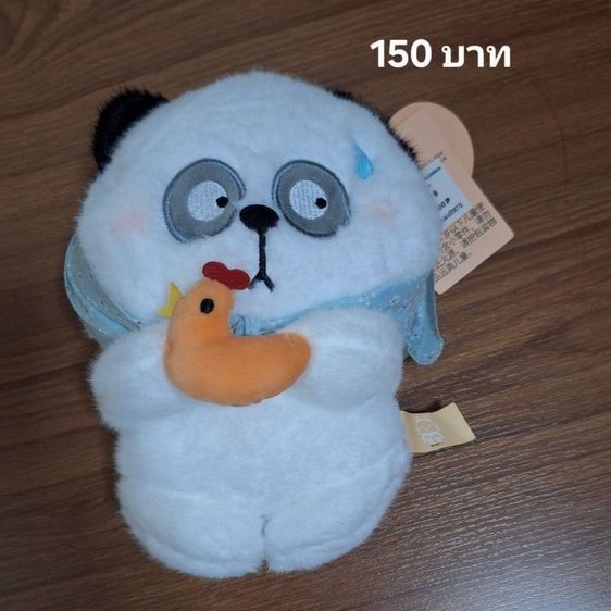 ตุ๊กตาตู้คีบ มือหนึ่งมีป้าย