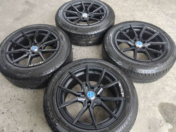 15" แม็ก naya ขอบ 15 กว้าง 7 สีดำด้าน พร้อมยาง Bridgestone B 22