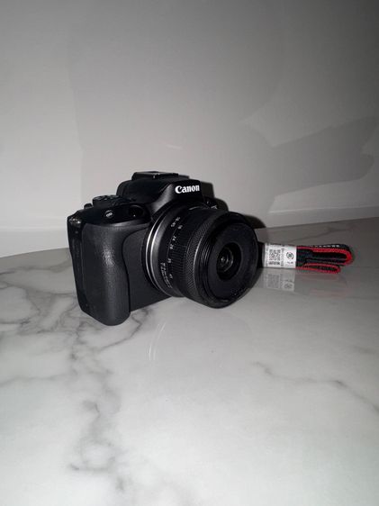 Canon EOS R50 kit camera + 18-45 mm lens (black), also includes a 64 GB memory card.