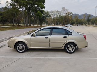 Chevrolet Optra สีบรอนซ์ทอง ปี 2003 เครื่องโตโยต้า