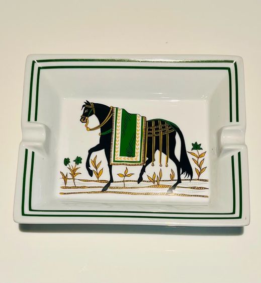 Original Hermès Paris porcelain ashtray featuring an elegant black horse design with green and gold decoration.